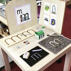 a child's table with letters and magnets on it