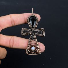 Handmade Copper Chain Size 18-20Inch - https://www.etsy.com/in-en/listing/1162990726 Welcome to our little shop, where you can find handmade copper wire jewelry and more, for you and your loved ones. We do accept custom orders also, kindly message us for more. Ankh Pendant Obsidian Eye Pendant Copper Wire Wrapped Pendant Hieroglyphic Symbol Ankh Necklace Cross Pendant with Gemstone Eye of Horus Gemstone : Obsidian Eye Pendant length : 9 CM Metal : Copper  * Protection:- Copper will be tarnished after a while so try to limit contact with lotions, soaps or anything moist and never wear it in the shower, swimming or anywhere else it may come in contact with water. If tarnish becomes an issue, you may clean this item with jewelry cleaning cloth or ultra polishing pads. * Packing:- Your jewelry Ankh Wire Wrap, Ankh Pendant, Ankh Necklace, Copper Wire Jewelry, Necklace Cross, Eye Of Horus, Eye Pendant, Copper Chain, Handmade Copper