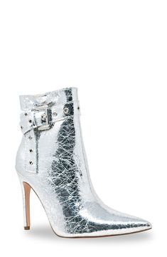 Gleaming grommets add street-savvy edge to this sleek pointed-toe bootie lofted by a sky-high stiletto heel. 4" heel 6" shaft; 9 1/2" calf circumference Synthetic upper, lining and sole Imported Party High-top Boots With Buckle Closure, Fitted Studded Boots With Pointed Toe, Fitted Silver Ankle-high Boots, Silver Pointed Toe Boots With Buckle Closure, Silver Fitted Ankle Boots, Trendy Fitted Boots With Studs, Fitted Pointed Toe Boots With Rivets, Sky High, Stiletto Heel