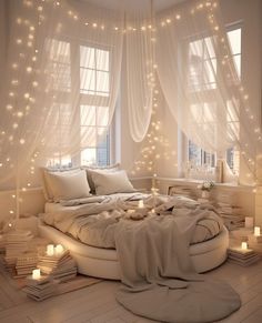 a round bed in a room with white curtains and lights on the windows above it