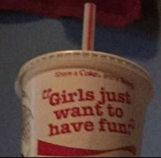 a paper cup with a straw sticking out of it's top and the words girls just want to have fun written on it