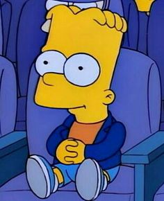 the simpsons is sitting in an auditorium with his feet up and looking at something off to the side