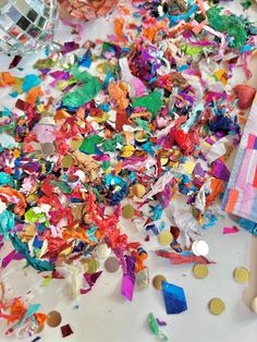 colorful confetti is scattered on the table