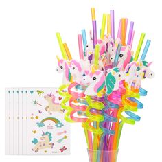 a vase filled with lots of different colored pencils and unicorn stickers on top of it