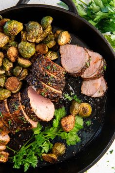 a cast iron skillet with pork, brussel sprouts and brussels sprouts