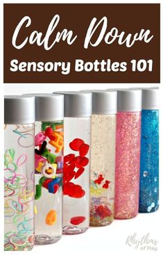 the bottles are filled with different colored liquids and have cartoon characters painted on them