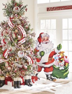 a christmas tree decorated with santa claus and ornaments