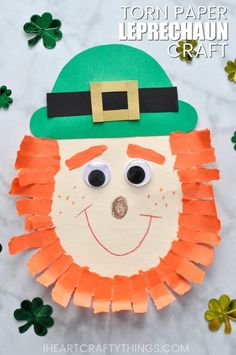 a paper leprechan craft with shamrock leaves