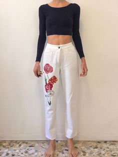 Super chic 1980s Kenzo white denim jeans with luxurious embroidery down one leg. Decadent red poppies have been embroidered climbing up one side. Love these white jeans - plus no back pockets for maximum 80s cool. Fabric is a medium weight cotton denim. High Waist. Front fly with metal zipper and one button at the waist. Front packets. No back pockets! Belt detail at back waist. Label Kenzo Jeans. 100% cotton, please wash cool delicate and drip dry. Very good vintage condition with no fabric or Spring White Jeans With Pockets, White Straight Leg Jeans For Spring, High Waist Cotton Jeans With Floral Embroidery, Casual White Pants With Floral Embroidery, White Casual Pants With Floral Embroidery, Trendy White Floral Print Pants, Spring White Five-pocket Pants, White Jeans With Five Pockets For Spring, White Five Pocket Jeans For Spring