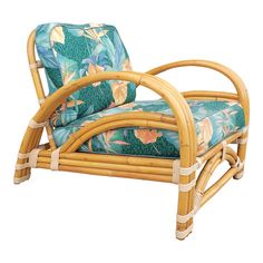 a chair made out of bamboo with a blue and green flower print cushion on it