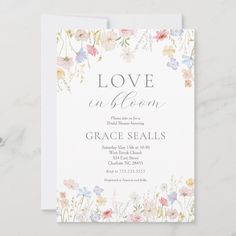 an elegant floral wedding shower card with the words love in bloom on it's front