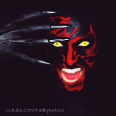 an instagram page with the image of a demonic face painted on it's fingers