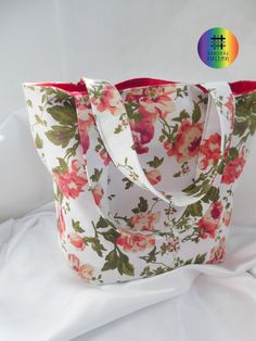 Small roses flower pink cream canvas tote book bag This stylish tote bag is made with premium canvas fabric featuring a beautiful 'roses flower' print fabric in shades of pink on a cream background. The roses print features on both sides with lining in a rich red canvas fabric. Medium sized handles attach to the bag in the same floral print. This bag has small to medium sized handles comfortable to hand carry and fits comfortably on the lower arm. Functional and durable as a book bag.  It has en Pink Floral Print Bag For Everyday Use, Pink Floral Print Shoulder Bag For Gift, Daily Use Pink Floral Print Bags, Cheap Floral Print Tote Bag, Pink Floral Print Tote Shoulder Bag, Stylish Tote Bag, Girls Handbags, Small Tote Bag, Peach Flowers