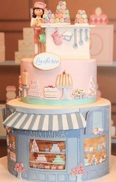 a three tiered cake is decorated in pastel colors and features an ice cream shop