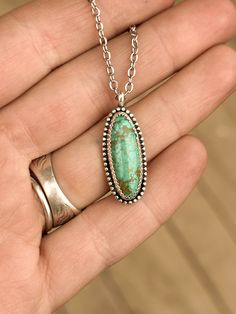 This necklace is handcrafted with .925 sterling silver & an authentic Carico Lake turquoise stone. Give me grace, I am new to silverwork, so this piece may not be totally perfect. That just adds to its authenticity! That being said though, I do think this pendant turned out quite well! The length of this necklace is roughly 18”. It’s assembled with stainless steel chain & a lobster clasp. Optionally, I can adjust the length for you, or I can add on a 2” extension chain to make it adjustable. The Nickel-free Turquoise Necklace With Silver Round Pendant, Artisan Turquoise Necklace In Sterling Silver, Nickel Free, Silver Wallet, Western-style Turquoise Necklace With Large Pendant As Gift, Silver Bohemian Turquoise Necklace, Soldered, Western-style Sterling Silver Turquoise Pendant Necklace, Sterling Silver Necklace Pendants, Silver Pendant Necklace, Turquoise Sterling Silver