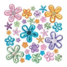 many different colored plastic flowers on a white background