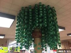 a tree made out of books in a library