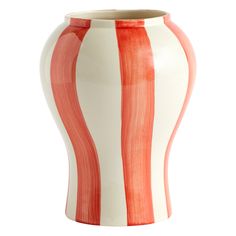 an orange and white striped vase is shown on a white background with red stripes in the bottom