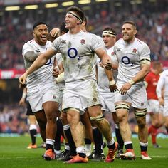 the england rugby team celebrates after their victory