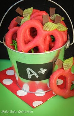 there are some candy pretzels in a pail with the letters a and o