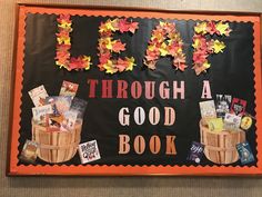 a bulletin board with flowers and leaves on it that says, let's through a good book