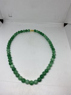 vintage Jade beaded 16 inch necklace graduated Gorgeous and delicate hand polished fun Jade Stone Color enhanced All jewelry is shipped free in the US in a nice gift box. Check out our over a THOUSAND great reviews Classic Necklace With 8mm Beads For Gift, Classic 8mm Beaded Necklaces As Gift, Classic 8mm Beads Necklace For Gifts, Classic 8mm Bead Necklaces As Gifts, Classic 8mm Bead Necklaces Perfect For Gifts, Jade Beaded Single Strand Necklace Gift, Jade Single Strand Beaded Necklace Gift, Classic Jade Necklace With Round Beads, Classic Jade Necklaces With Round Beads