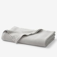 a white blanket folded on top of each other