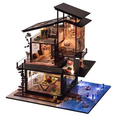 a doll house with all the furniture and accessories in it's display case is shown