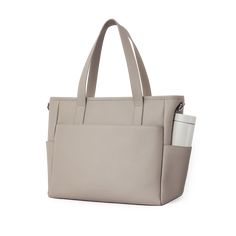 This structured tote is the ultimate do-it-all bag that you deserve. It's the perfect carryall for work, travel, and anywhere your day brings you. It features a spacious and organized interior for your essentials, a padded compartment for your laptop, side pockets for your drinks, and you can convert it into a backpack or crossbody. Crafted from premium American Saffiano leather that's waterproof and scratch-resistant, the Transform Tote will stay just as beautiful through all your travels and a Classic Everyday Laptop Bag With Zipper Pocket, Minimalist Large Capacity Shoulder Bag For Travel, Workwear Laptop Tote Bag With Zipper Pocket, Workwear Laptop Tote With Zipper Pocket, Functional Leather Diaper Bag For Daily Use, Modern Weekender Bag With Removable Pouch For On-the-go, Travel Laptop Bag Tote With Zipper Pocket, Everyday Rectangular Laptop Bag With Removable Pouch, Travel Laptop Bag With Zipper Pocket And Tote Shape