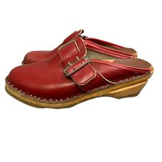 Vintage Bastad Toffeln red leather clogs. Size 36 which is equal to a US size 6 or 6-1/2. Good condition except for distressing to wood at front of each shoe (see photos). Not coming apart but the damages are there. Condition: Pre-Owned Good Red Closed Toe Mules With Leather Sole, Vintage Clogs With Leather Sole And Closed Toe, Vintage Closed Toe Clogs With Leather Sole, Vintage Leather Sole Closed Toe Clogs, Vintage Clogs With Rubber Sole And Round Toe, Vintage Closed Toe Mules With Rubber Sole, Red Clogs With Leather Footbed And Round Toe, Red Leather Clogs With Wooden Heel, Red Leather Footbed Slip-on Mules