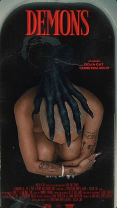 the poster for demon's shows a woman with her hands on her chest and black gloves