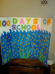 a bulletin board with the words 100 days of school written on it in front of a piano