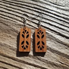 "Wood earrings in a rectangle shape with cutouts that make it look like branches or trees handcrafted from Genuine California Redwood in the USA in a small father and daughter wood shop in Northern California. Nickel Free Wire Hooks Wood is sealed - lightly coated with a a clear finish. Approximately 1\" x .5\" x .125\" thick This is not the exact pair of dangle hook earrings that will be shipped. Wood grain and coloring will vary with each piece. Our redwood earrings and necklaces are made out Father And Daughter, Tree Earrings, Earring Tree, Wood Ornaments, Wood Earrings, Handmade Wood, Wood Shop, Hook Earrings, Northern California