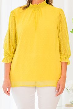 You'll be ready for anything in this adorable top! This top is perfect for any occasion! The high neckline, stylish swiss dot pattern, and bold mustard color make this an ideal wardrobe staple! The timeless design will take you from a brunch date to the office in style! Self - 100% Polyester Lining - 100% Rayon Yellow Spring Office Tops, Chic Swiss Dot Blouse For Workwear, Chic Swiss Dot Tops For Work, Chic Swiss Dot Tops For Workwear, Chic Yellow Blouse For Office, Chic Mustard Top For Brunch, Chic Yellow Blouse For The Office, Chic Yellow Office Blouse, Spring Swiss Dot Tops For Work