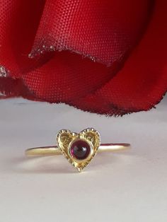 Sweet Heart Ring, Stackable Heart Ring made of goldfield 14 karats or silver heart stacking ring. Dainty gold heart, Great birthday gift idea for girls. Any size to order. Gold heart size about 0.3 inches. Garnet stone size: 3mm. Choose your birthstone 🔸 All my creations made by me from Fine Materials, Gemstones, high quality. 🔸 Unique Technique in different textures styles and trends Lots of investment to give you one more moment of joy. 🔸 Ask me any question, my customer service is availabl Dainty Heart Birthstone Promise Ring, Dainty Heart Shaped Birthstone Promise Ring, Dainty Heart-shaped Promise Birthstone Ring, 14k Gold Heart-shaped Solitaire Ring, Dainty Heart Ring With Birthstone For Anniversary, Heart-shaped 14k Gold Ruby Promise Ring, Valentine's Day Gift Birthstone Open Ring, Stackable 14k Gold Rings For Valentine's Day, Valentine's Day Gift Open Birthstone Ring