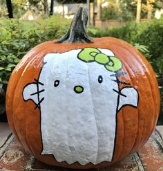 a pumpkin decorated to look like hello kitty