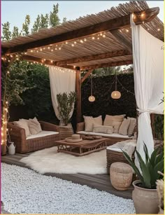 an outdoor living area with couches and lights