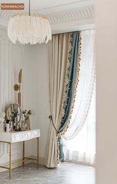 a room with a table, mirror and curtains on the window sill in it