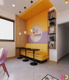 a yellow couch sitting in front of a window next to a table with two chairs