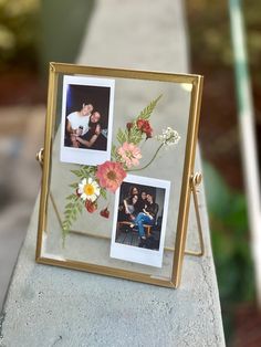 an old photo frame with flowers and two photos in it sitting on a concrete ledge