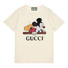 This GUCCI x Disney Mickey Mouse Logo Short Sleeve T-shirt is a must-have for any fashionista. The classic silhouette and graywhite colorway make it a timeless piece. The oversized design features a vintage Mickey Mouse logo and a playful image of Mickey Mouse, making it a perfect choice for any occasion. The iconic Disney character appears in Gucci's 2020 Spring collection with colorful prints, embroidered patches or jacquard patterns. Celebrate the Chinese Mouse Year in style with this timeles Gucci Mickey Mouse, Mickey Mouse Tshirt, Mickey Mouse Logo, Mickey Mouse Svg, Mouse Logo, Disney Mickey Mouse, Disney Mickey, Oversized Tshirt, T-shirt