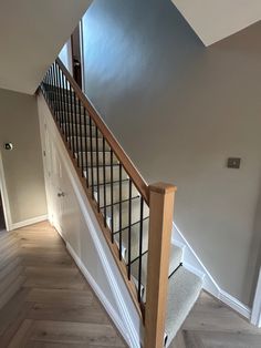 Hall makeover; Flooring from @tapicarpetsandfloors - Herringbone hard flooring and 100% wool carpet and runner along with black rods. Staircase from @nevillejohnson Oak posts, oak handrail and black metal spindles. Paint - Elephants breath from @farrowandball and eggshell brilliant white on woodwork. Accessories to be added further and internal doors to be changed to oak. All sockets and handles changed to brushed chrome. Oak Stairs Black Spindles, Oak Staircase With Metal Spindles, Oak And White Staircase With Runner, Oak Stairs Black Railing, White Staircase Black Spindles, Painted Staircases With Carpet, Oak Staircase With Carpet Runner, Oak Staircase With Carpet, Changing Stair Spindles