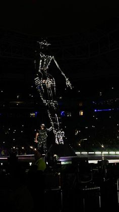 the skeleton is projected in the dark on stage