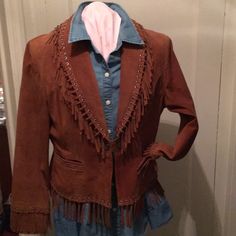 Stunning Cognac Colored Suede Jacket With Fringe Detail. Two Front Pockets, Single Snap Front Closure. Fully Lined. Fitted Western Leather Jacket With Long Sleeves, Brown Western Long Sleeve Outerwear, Western Style Brown Long Sleeve Outerwear, Winter Leather Jacket For Rodeo With Long Sleeves, Winter Leather Jacket For Rodeo, Western Style Long Sleeve Workwear Outerwear, Western Style Long Sleeve Outerwear For Work, Western Style Workwear Outerwear, Western Style Fitted Blazer For Fall