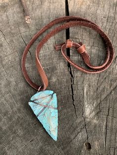 "This is my fresh spin on a wire wrapped classic. Arrowheads have been worn as jewelry for ages and are a recognizable symbol of alertness, walking the straight and narrow & strength. The arrowhead I used is made of jasper stone and is a hand knapped modern replica. It was made in the same tradition and with the same primitive techniques that early man used. I added a lovely pale turquoise & gold highlight patina then wire wrapped it with blackened (oxidized) copper wire. This is a great Southwestern Hand Wrapped Adjustable Jewelry, Adjustable Southwestern Hand Wrapped Jewelry, Southwestern Adjustable Hand Wrapped Jewelry, Adjustable Southwestern Style Hand Wrapped Jewelry, Rustic Patina Jewelry For Festival, Bohemian Hand Forged Adjustable Necklaces, Bohemian Adjustable Hand Forged Necklaces, Artisan Necklace With Adjustable Patina, Adjustable Bohemian Hand Forged Necklaces