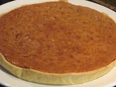 a pie sitting on top of a white plate