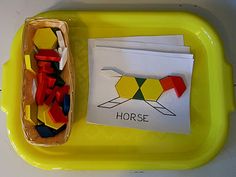 a yellow tray with some sort of toy on it and a card that says horse