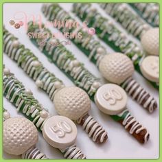 many white and green candies with numbers on them are lined up in a row