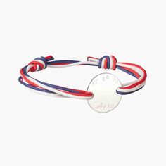 Our Men's Personalized Olympic Bracelet is a fun way to represent a country in bracelet form. Choose three colorful braid colors to represent your flag and pair with a hand-engraved disc. Add names, dates, and words for an extra-special touch to this unique bracelet.&nbsp;925 Sterling SilverCharm: 0.8”x0.8”Braid made of durable, colorfast polyesterSize: between 8-9, fully adjustable sliding knot fasteningEngraved by hand in our Paris workshopSent with love in a complimentary gift boxAny slight variations in lettering depth, spacing and alignment from the examples shown are part of the aesthetic and originality of the piece Adjustable Engraved White Bracelets, White Adjustable Engraved Bracelets, White Engraved Adjustable Bracelet, Braid Colours, Braid Colors, Crystal Dice, Adjustable Sliding Knot, Birth Gift, Grandmother Gifts