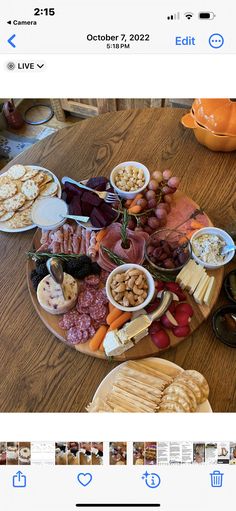 a table topped with lots of different types of food on top of a wooden table